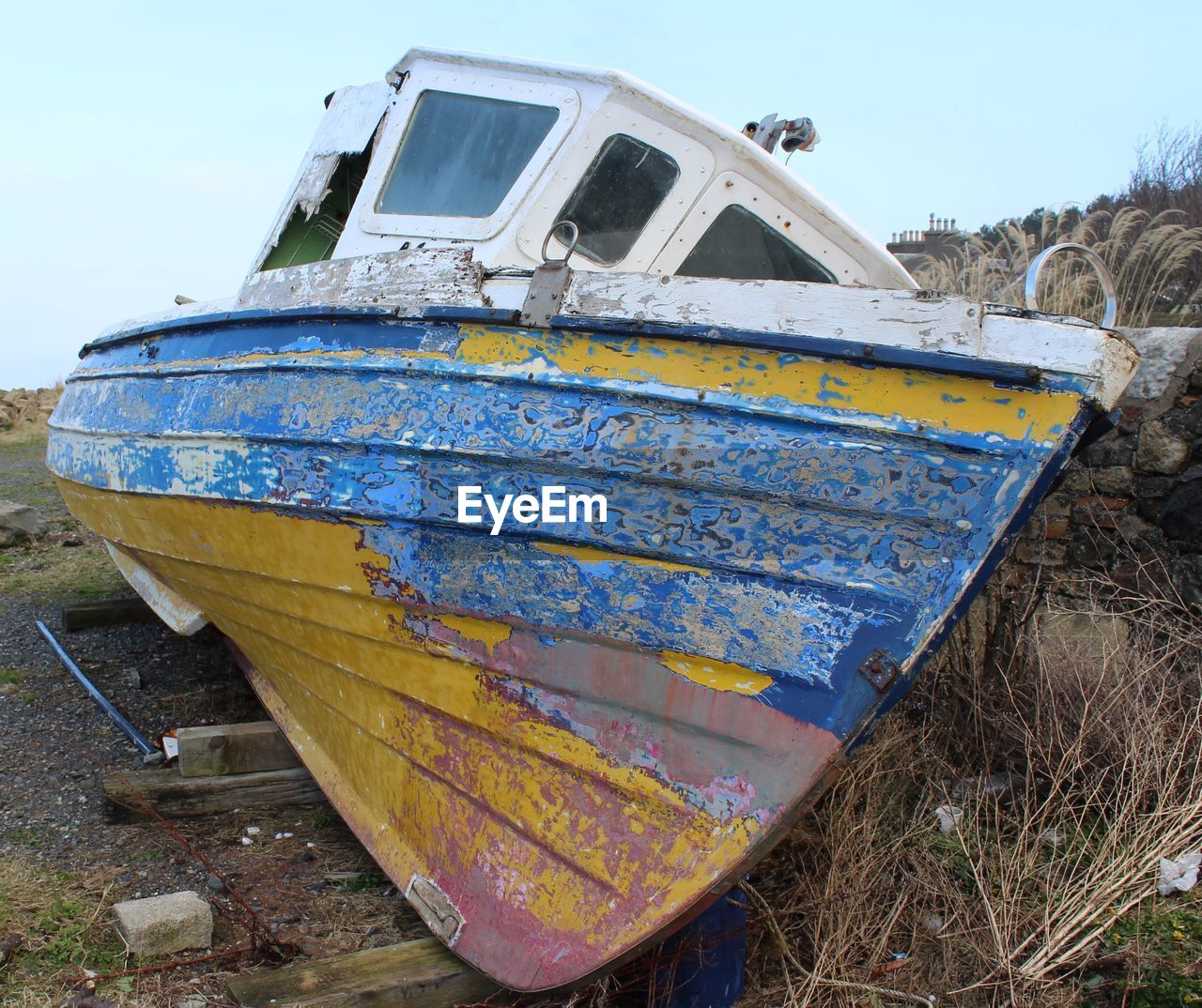 Close-up of abandoned boat on shore