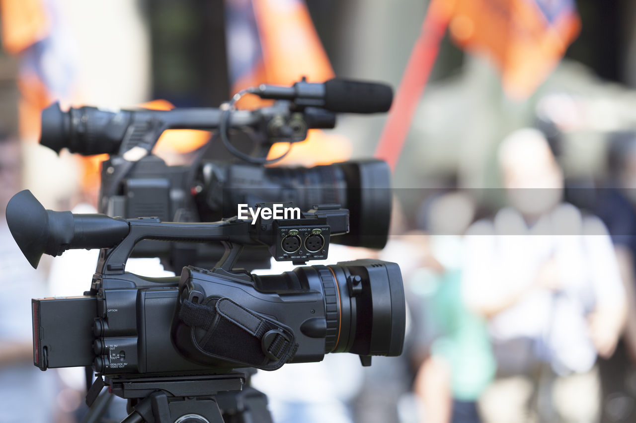 Close-up of television cameras on tripod