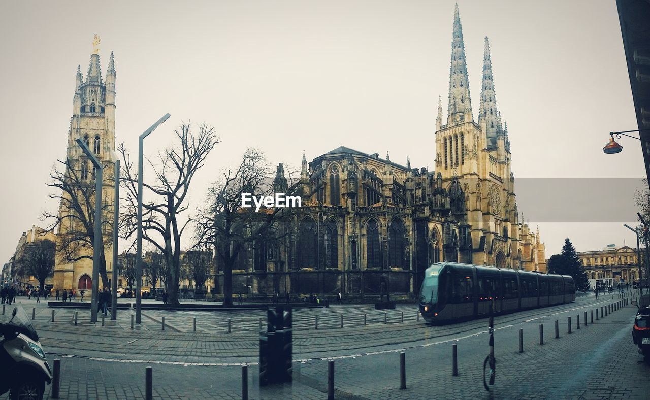 Bus on road against buildings