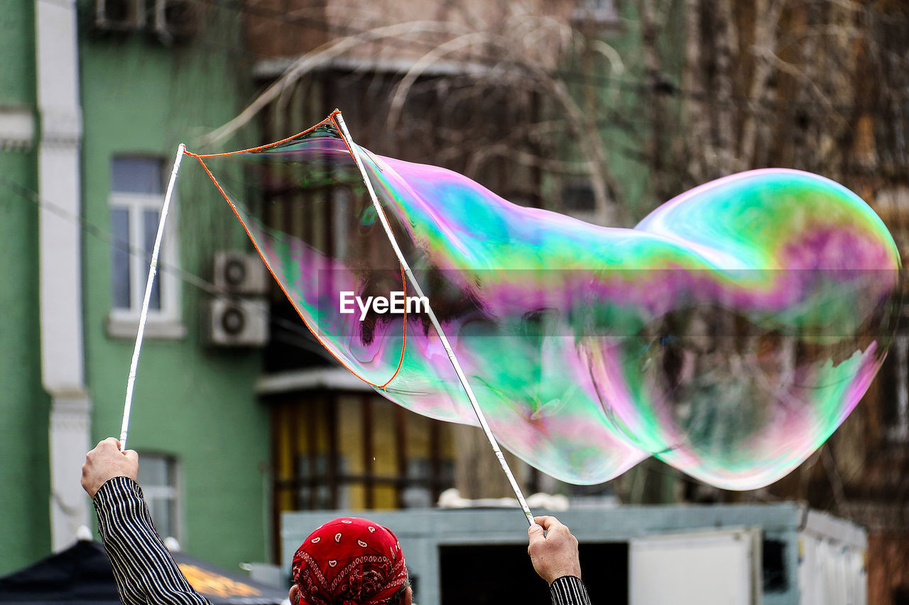 Street performer making soap bubble