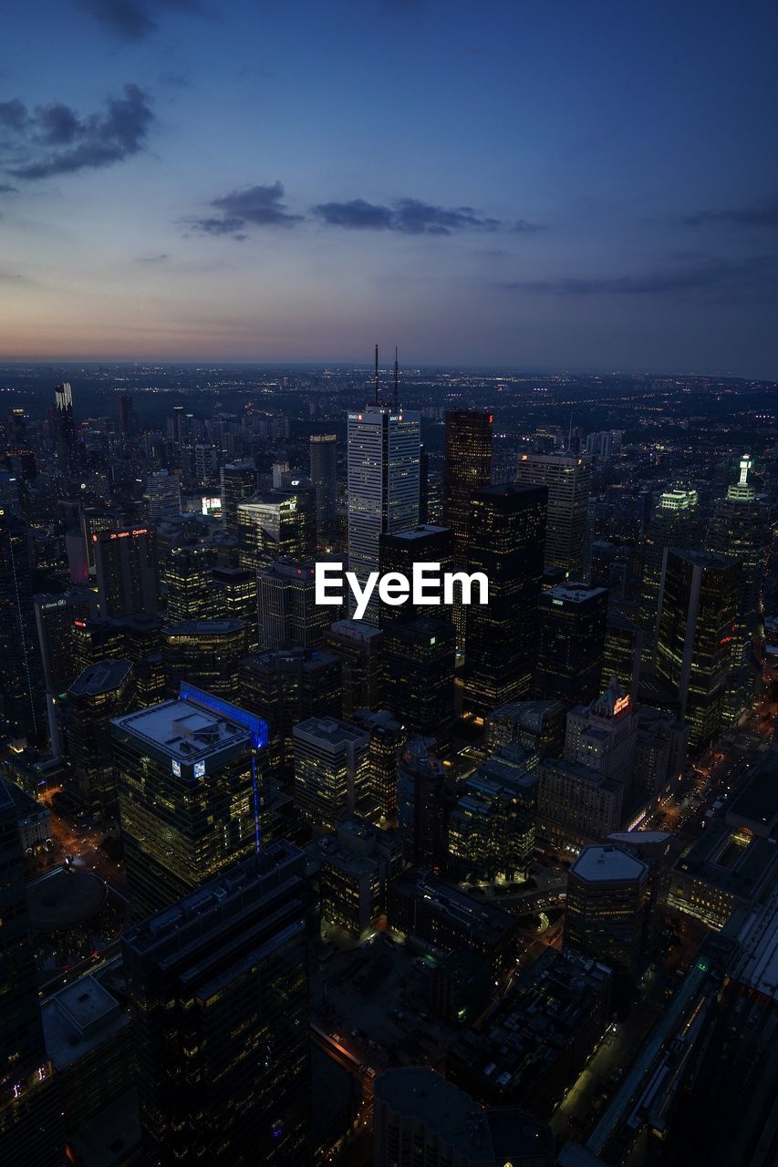 High angle view of illuminated city against sky