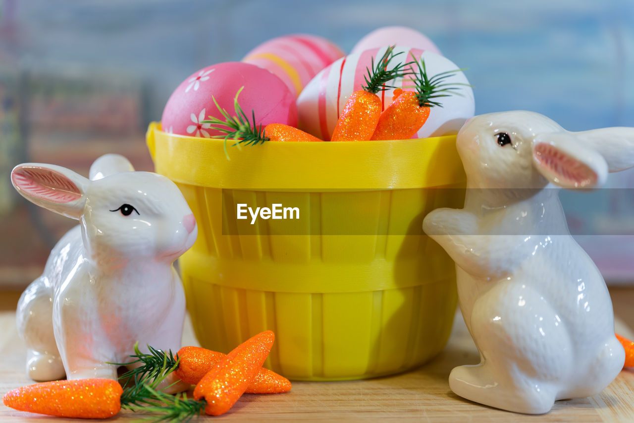 Close-up of easter eggs and bunnies on table