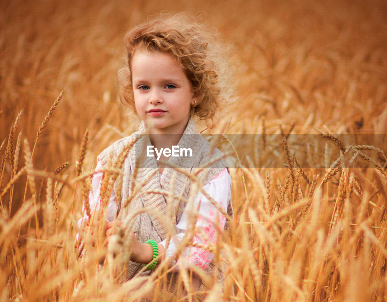 Close-up of girl blowing spider web