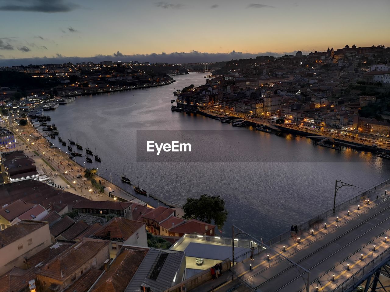 HIGH ANGLE VIEW OF CITY AT RIVERBANK