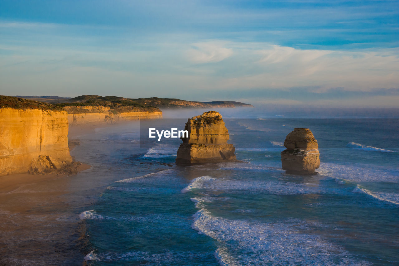 Scenic view of sea against cloudy sky
