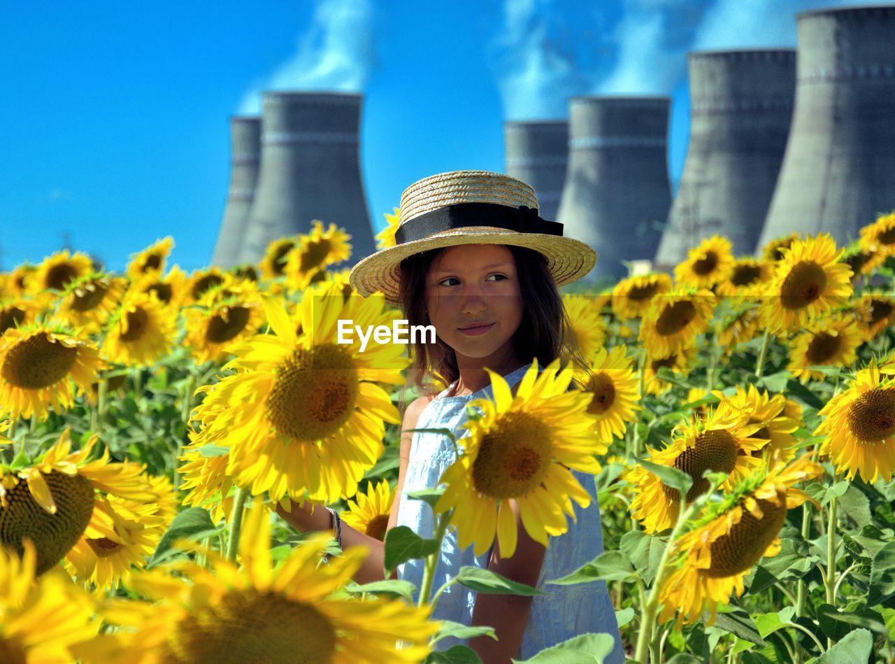 Portrait of woman with yellow flowers