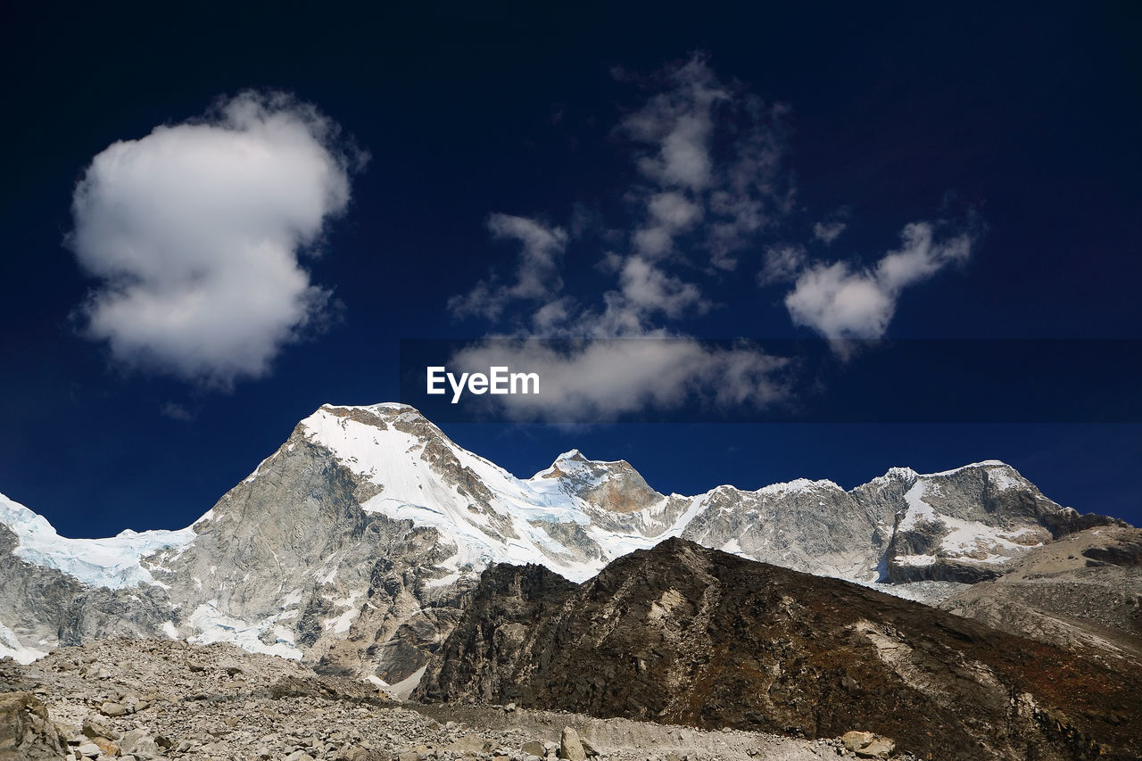Scenic view of huascaran mountain against sky