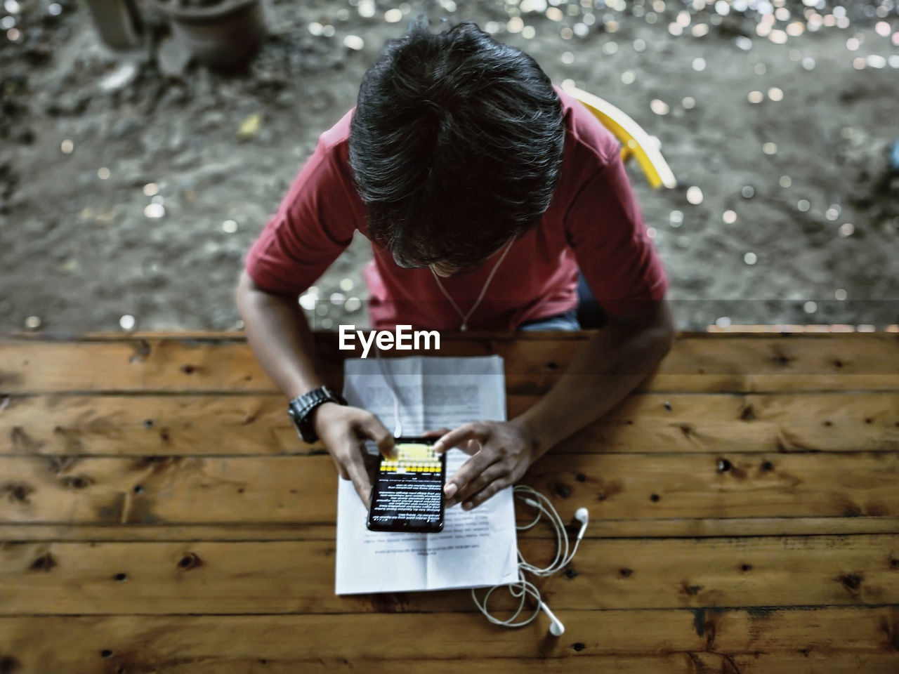 High angle view of man using mobile phone