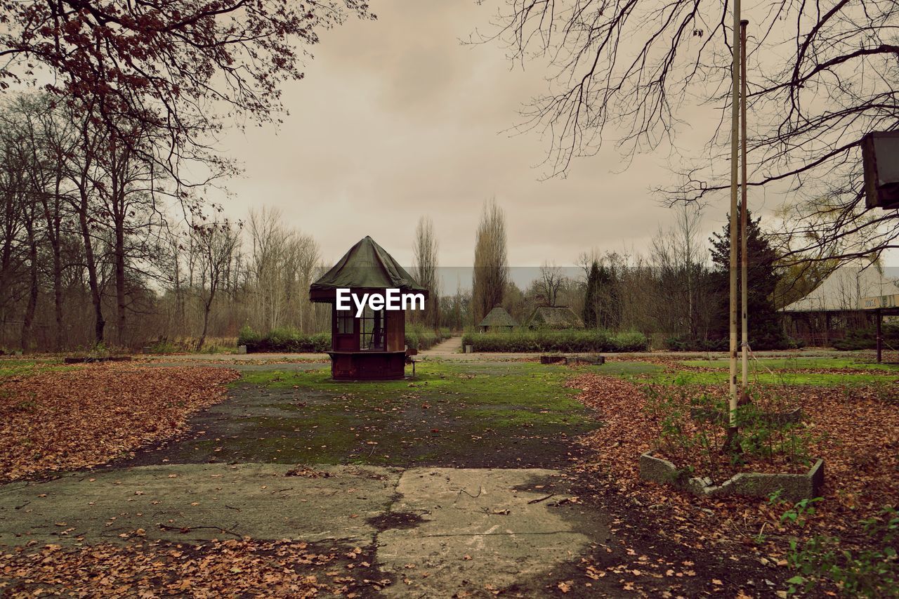 Abandoned structure on field against sky