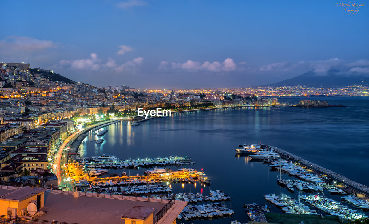 High angle view of illuminated cityscape against sky