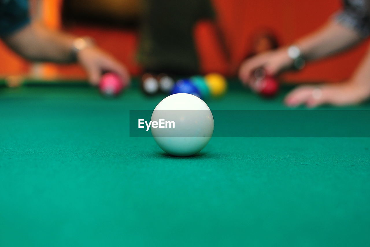 Close-up of pool ball on table