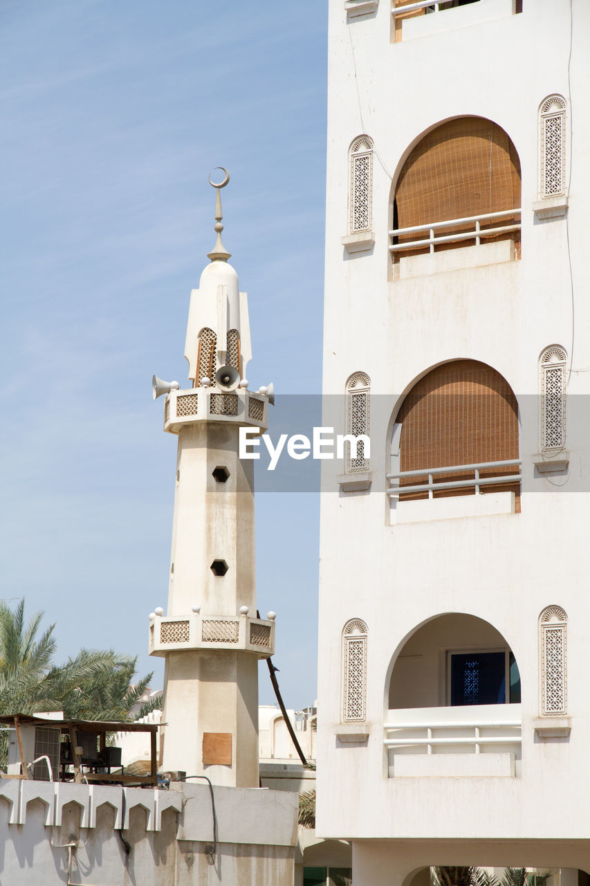 Low angle view of mosque against sky