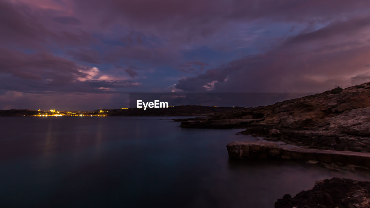 Scenic view of cloudy sky at night