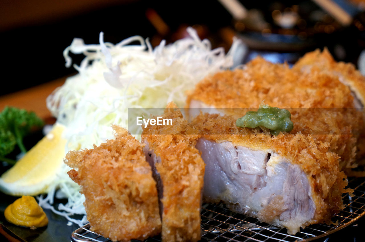 Close-up of fresh fried chicken served at restaurant