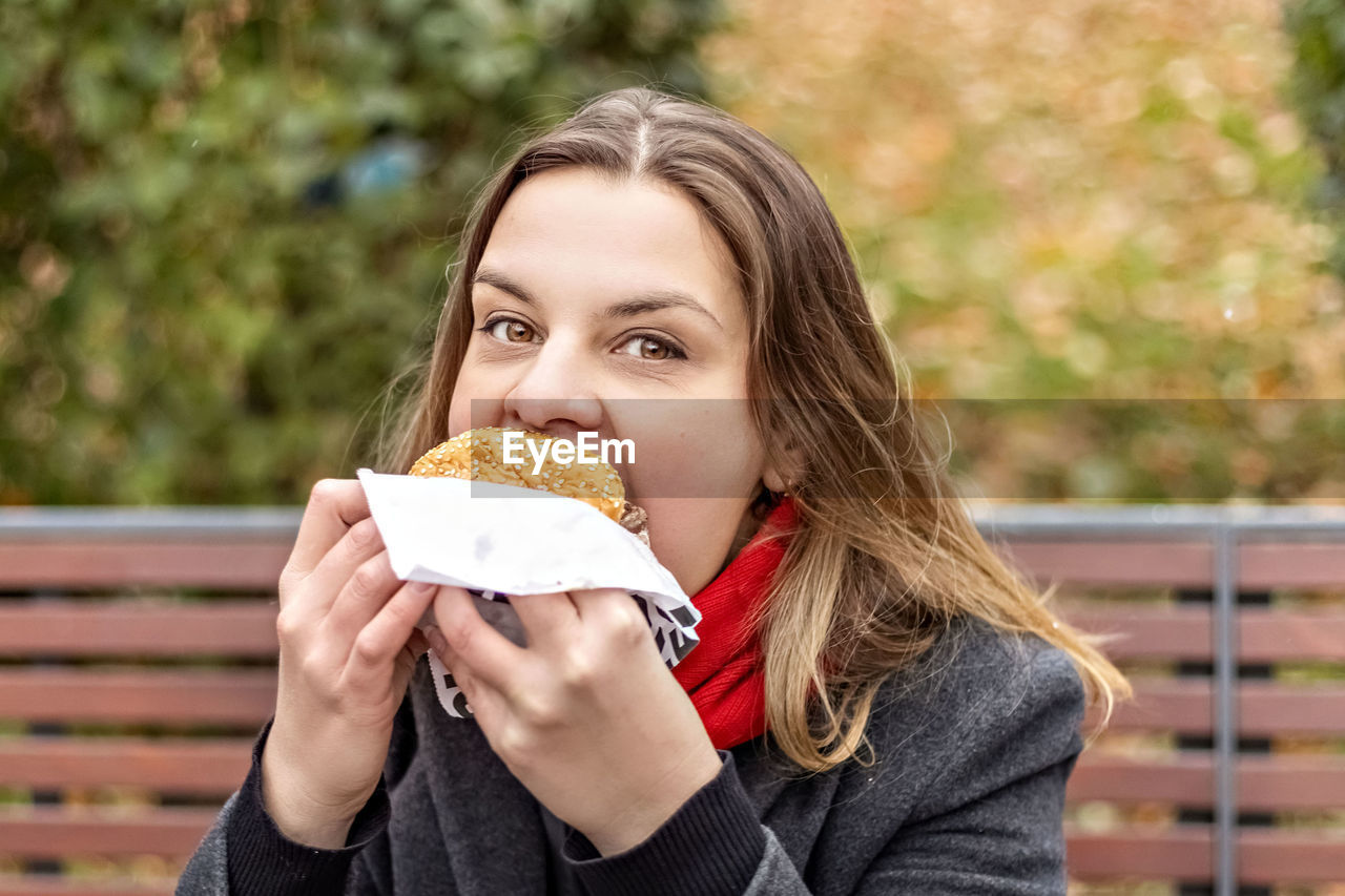 Portrait of woman eating food