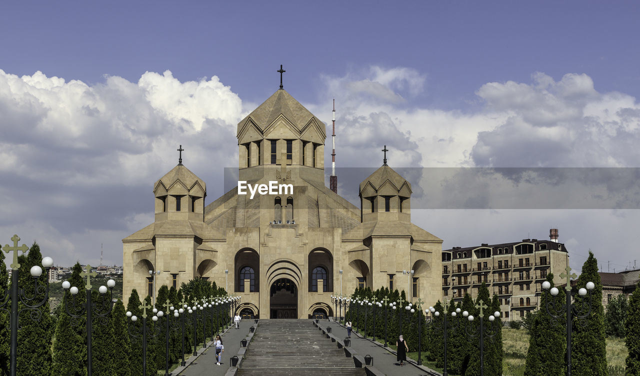 VIEW OF TEMPLE AGAINST CLOUDY SKY