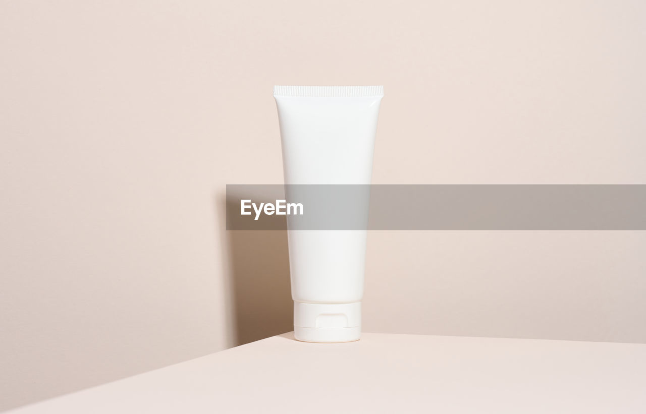 Empty white plastic tubes for cosmetics. packaging for cream, gel, serum, advertising and 