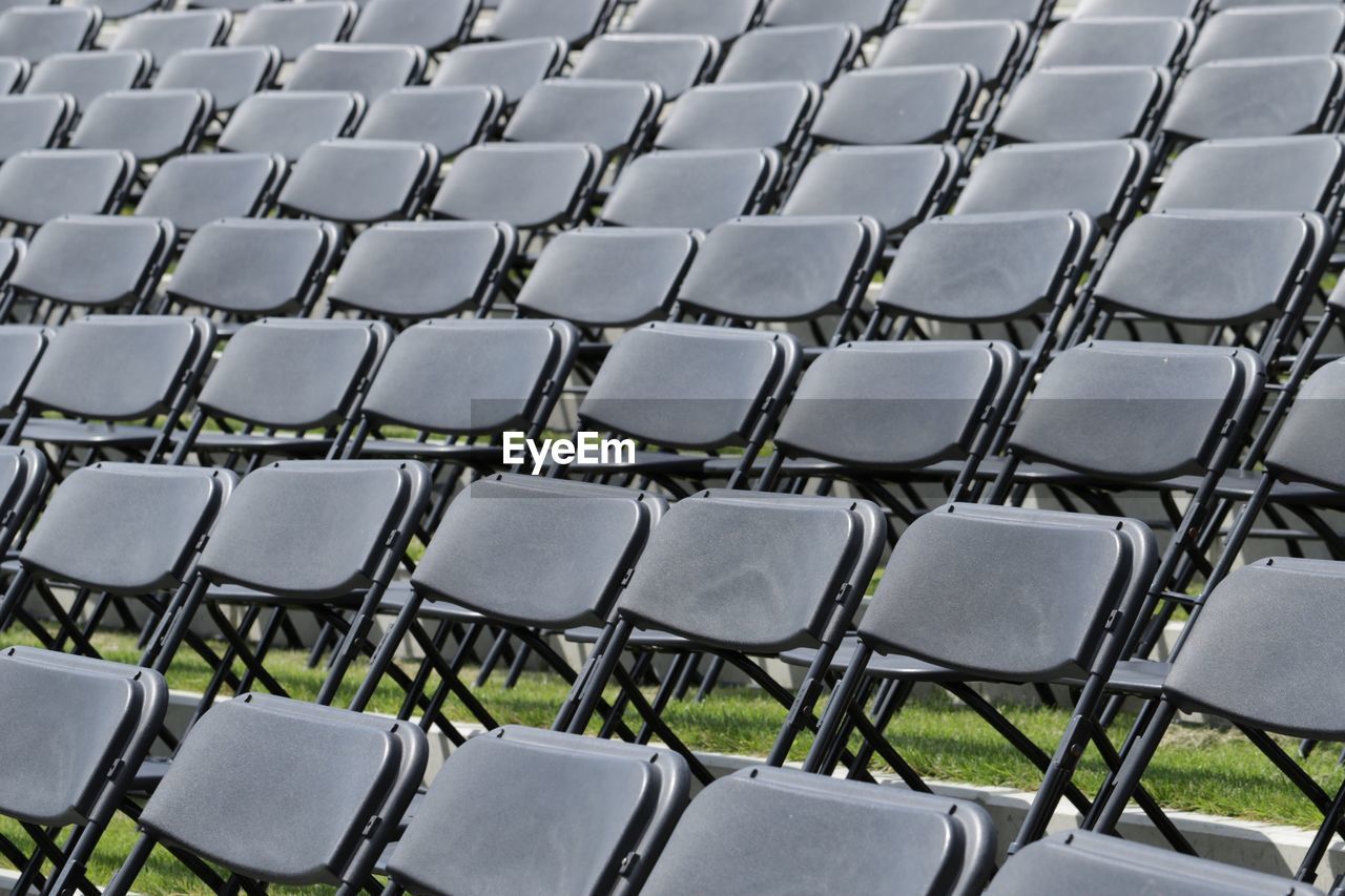 Full frame shot of folded chairs at stadium