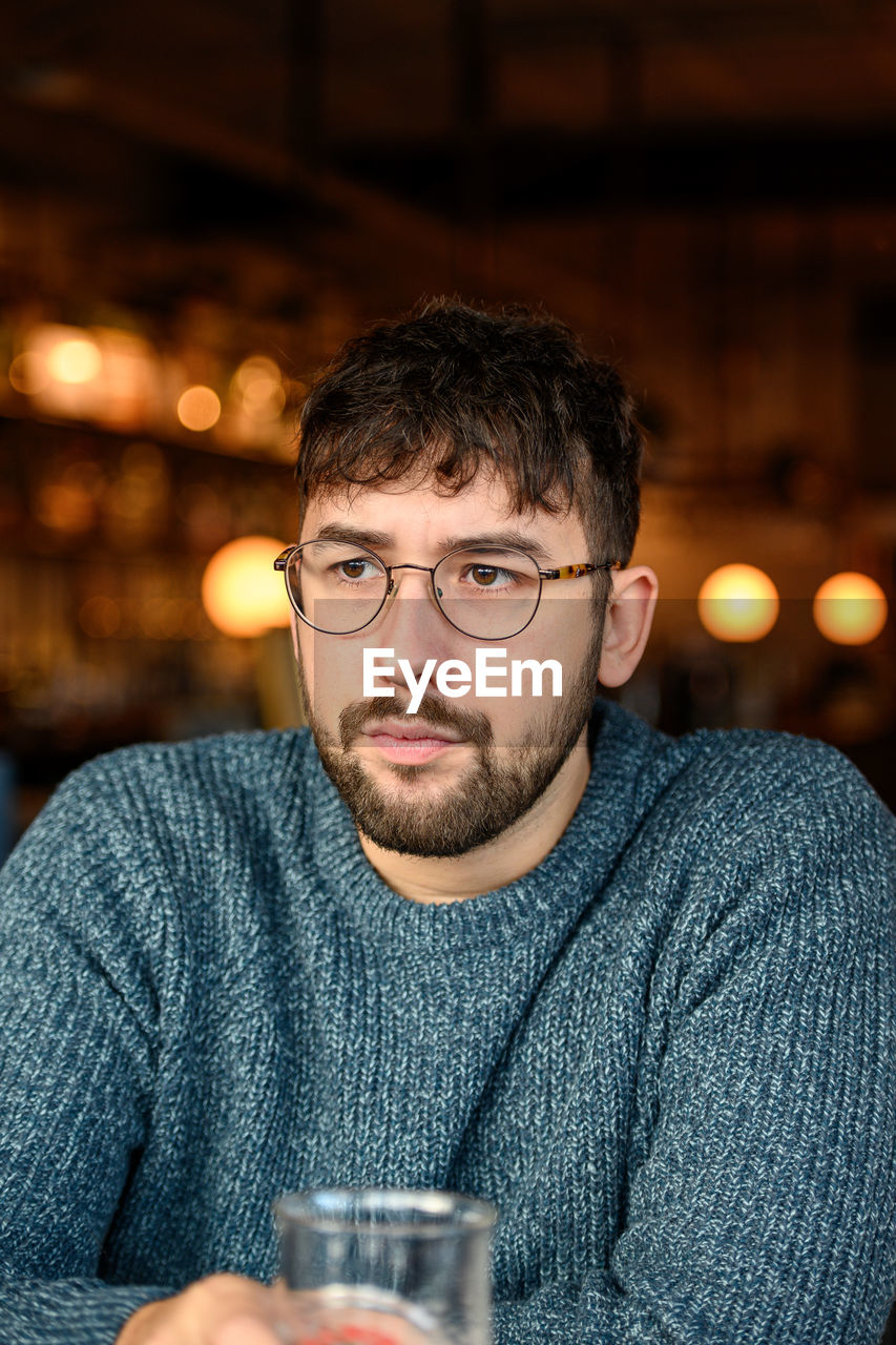 Portrait of young man at restaurant