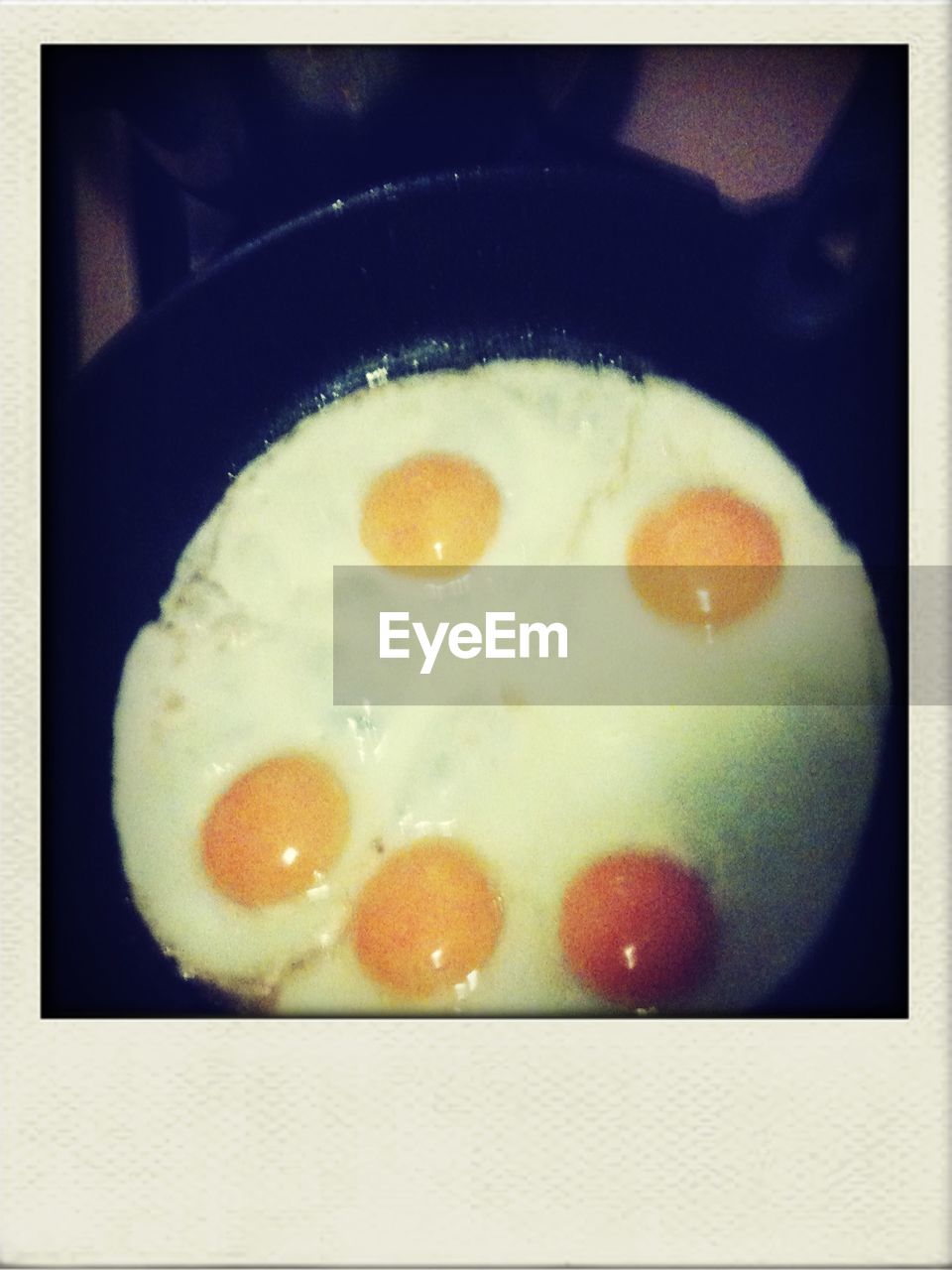 High angle view of egg on frying pan