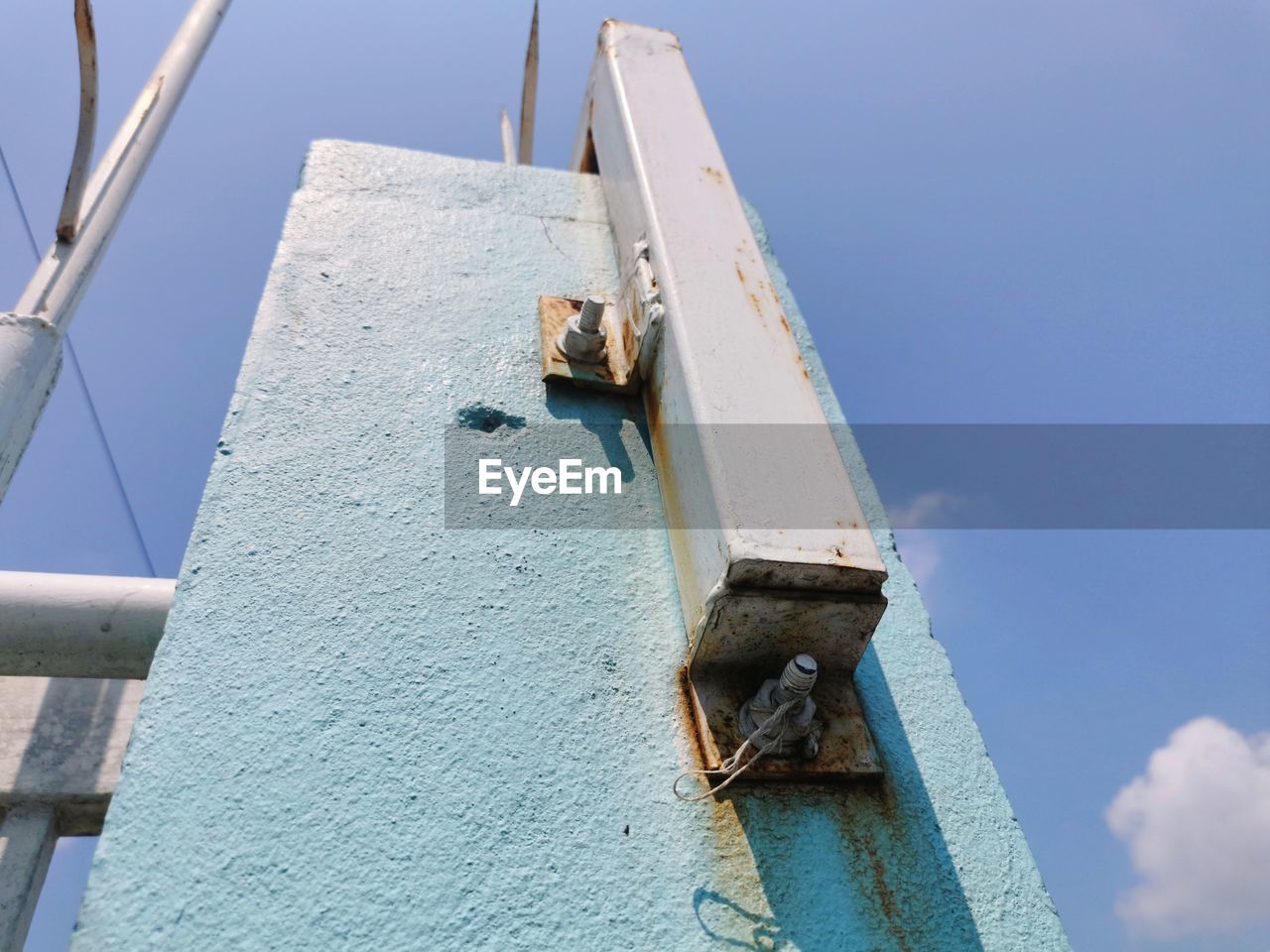 LOW ANGLE VIEW OF A HORSE ON METAL STRUCTURE