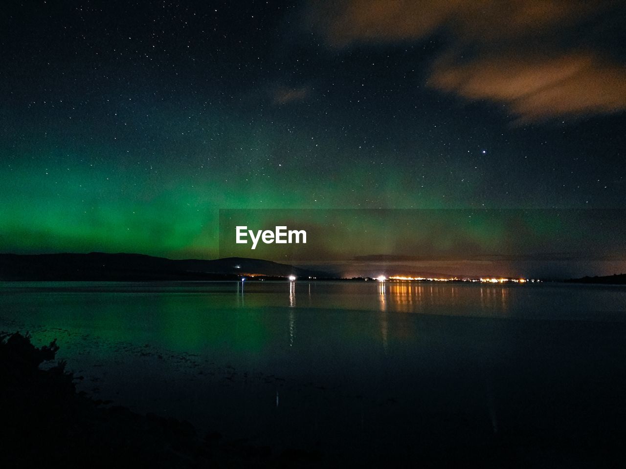 Scenic view of landscape against sky at night