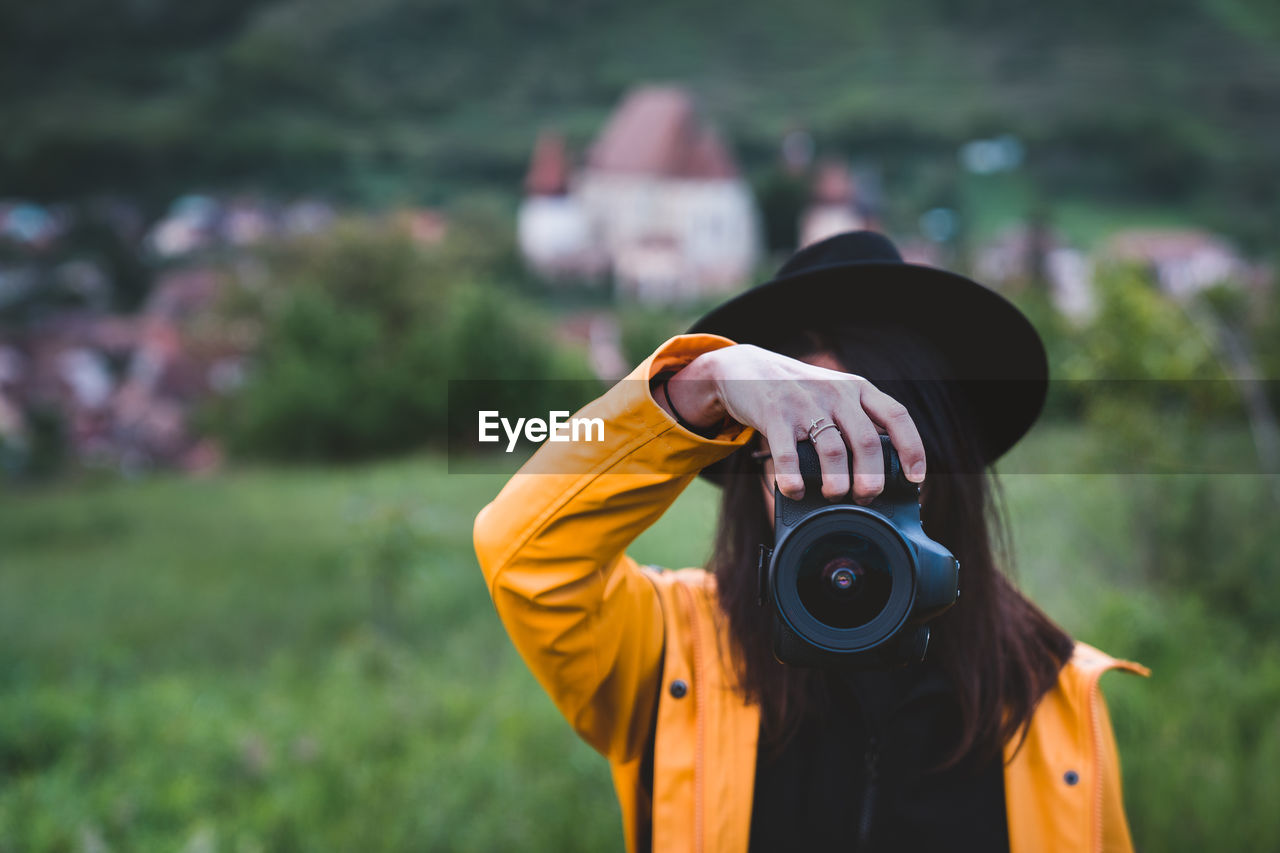 Woman photographing with camera