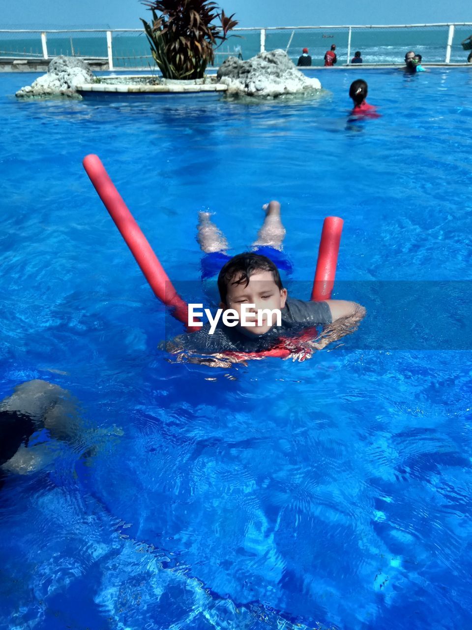 Boy swimming in pool