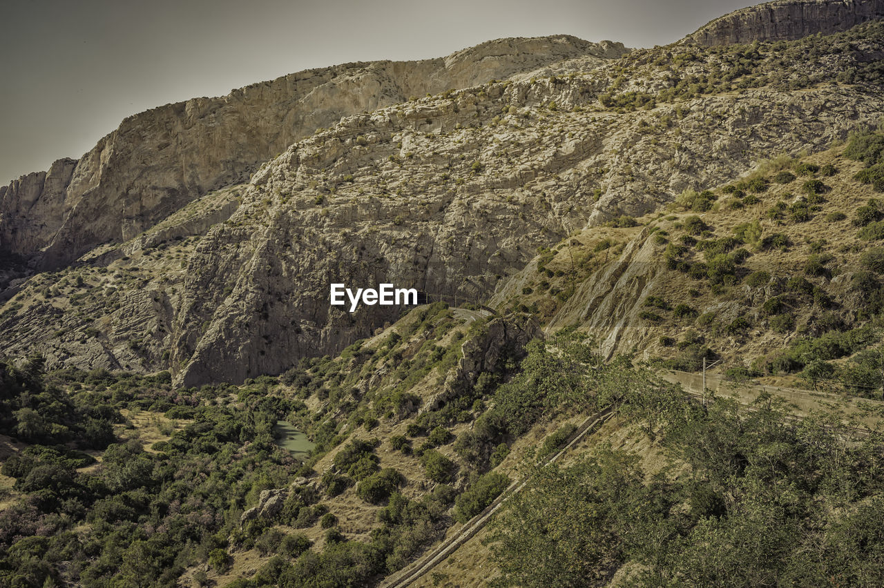 Scenic view of landscape and mountains against sky