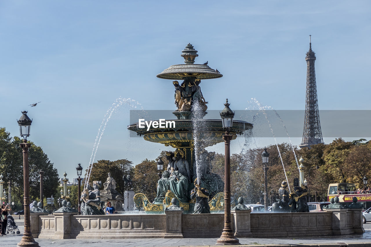  beautiful fountain in place de la concorde with eiffel tower in background in paris