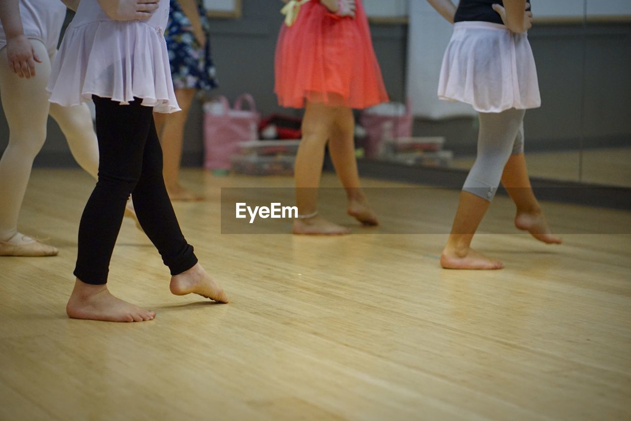 Low section of people dancing on floor