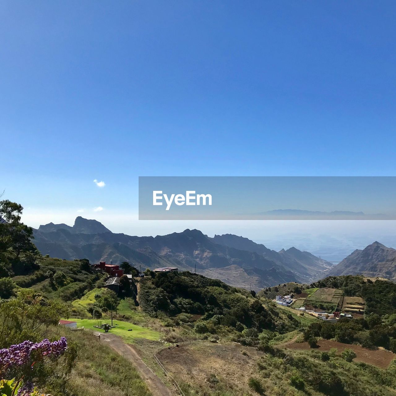 Scenic view of landscape against clear blue sky