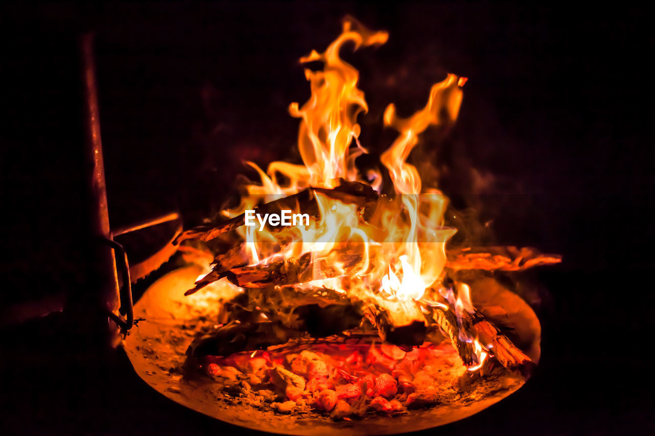 Close-up of fire in pit at night