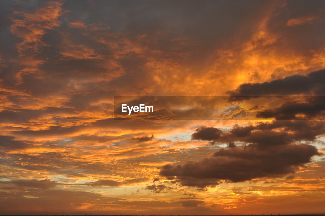 Low angle view of dramatic sky during sunset