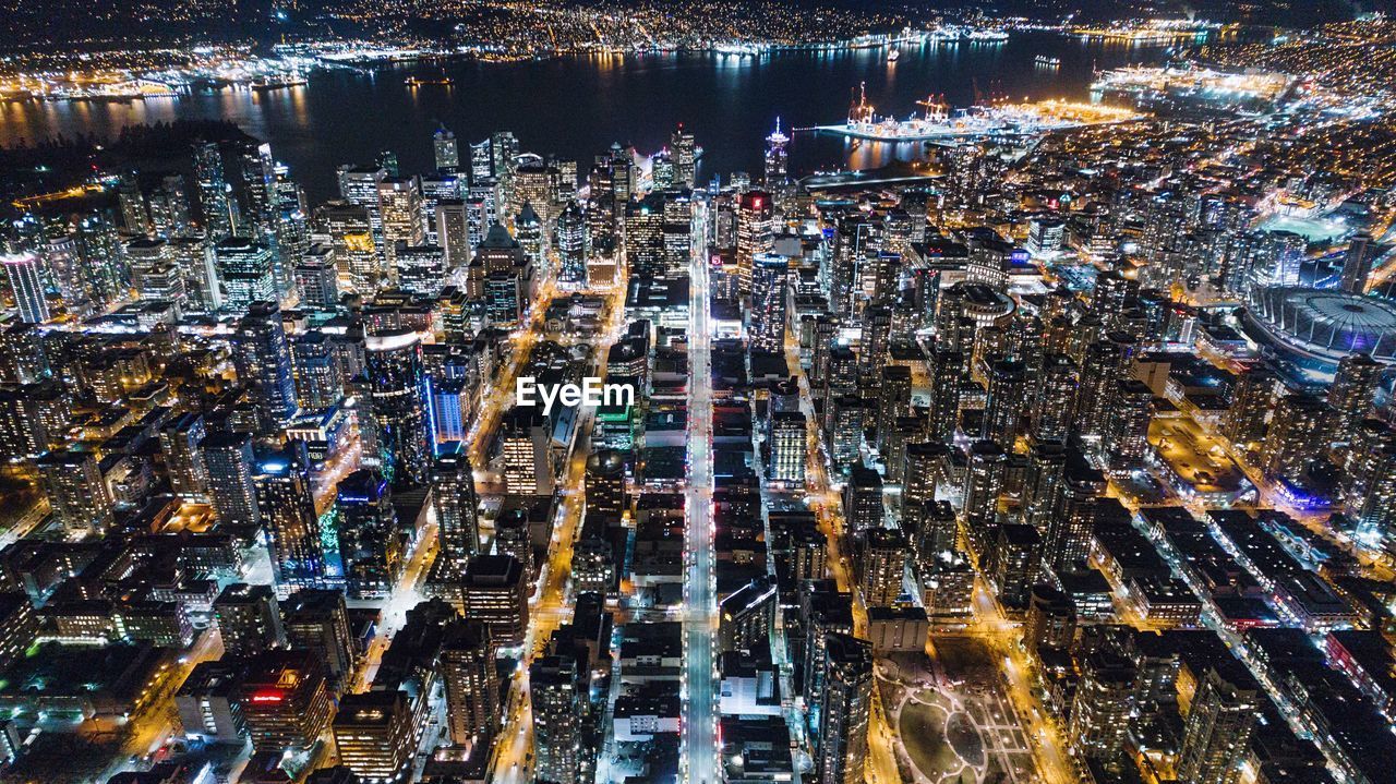 Aerial view of illuminated cityscape at night