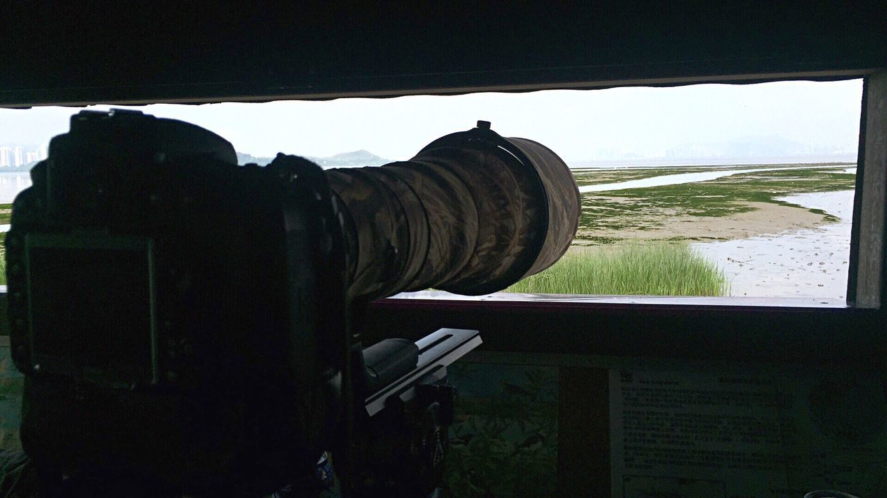 Camera in hut against sky