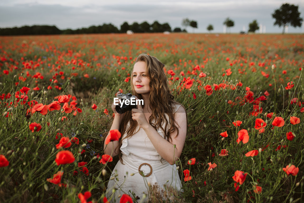 Woman standing on field