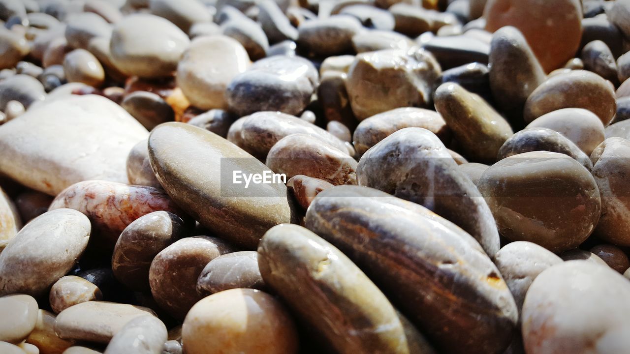 Full frame shot of stones on sunny day