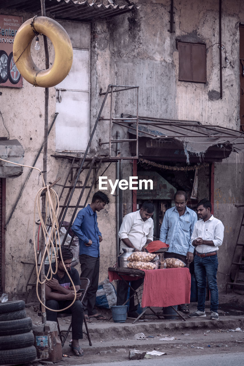 GROUP OF PEOPLE WORKING AT MARKET