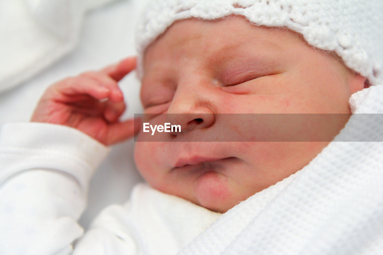 Close-up of baby boy sleeping at home