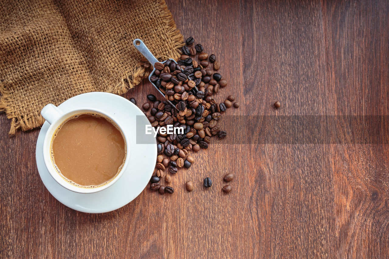 HIGH ANGLE VIEW OF COFFEE CUP WITH COOKIES ON TABLE