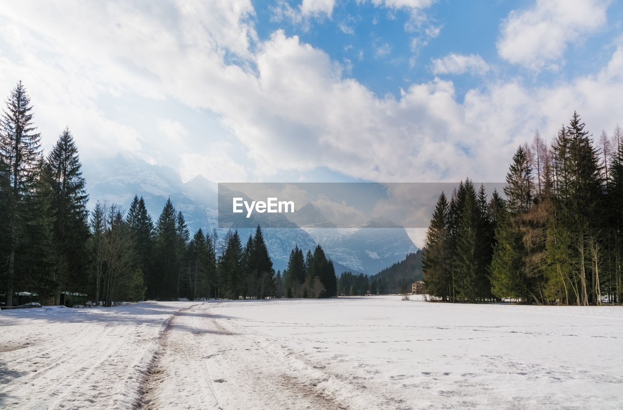 Scenic view of snow covered landscape against sky