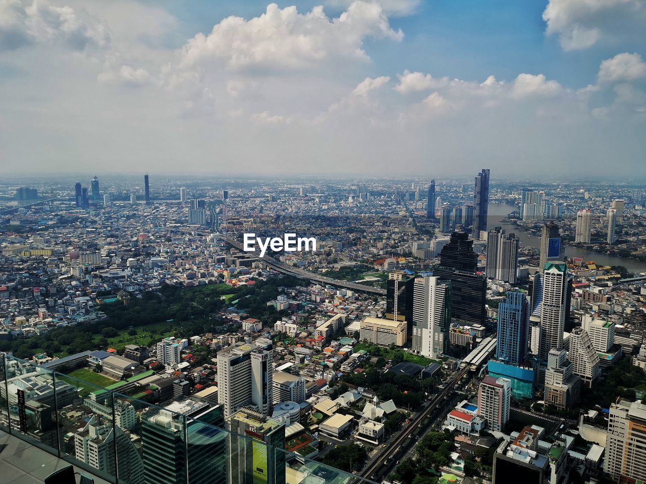 High angle view of modern buildings in bangkok against sky