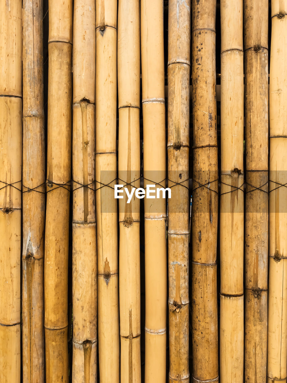 Old brown tone bamboo simple wall or bamboo fence texture background for  design vintage tone. 