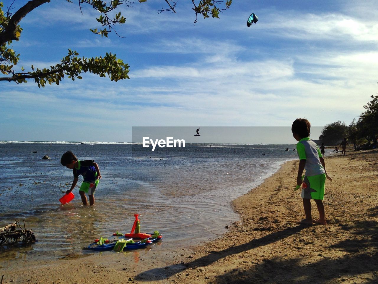 Twin boys playing at beach