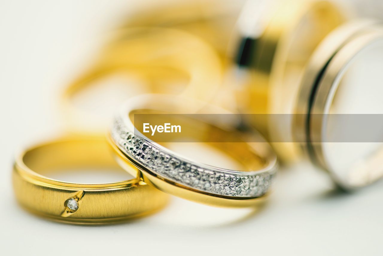 Close-up of wedding rings on table