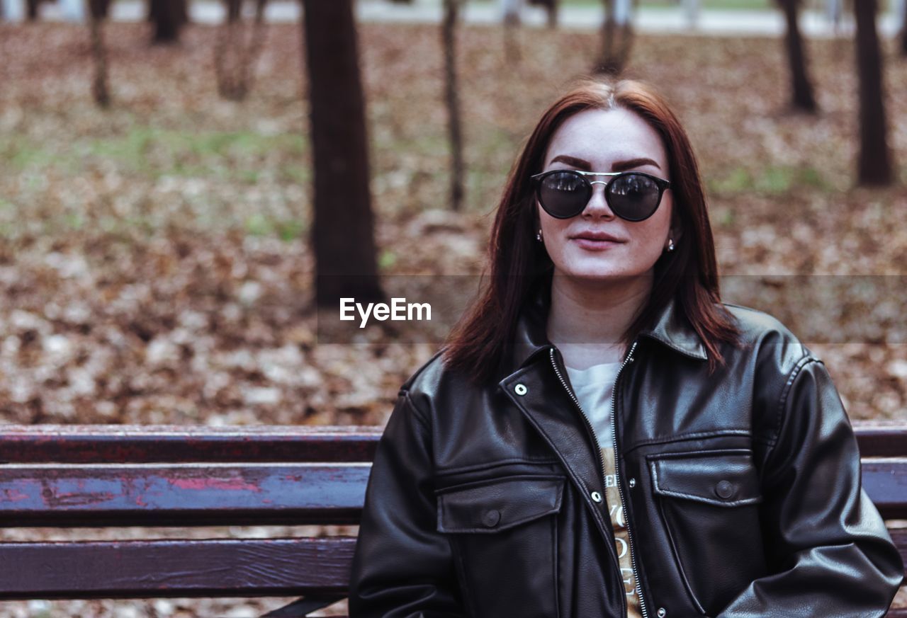 Portrait of woman wearing sunglasses outdoors