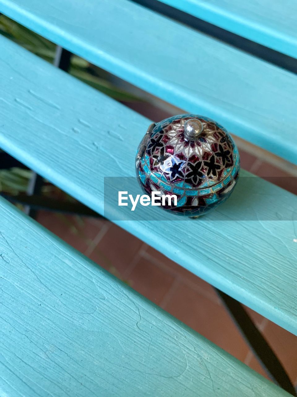 blue, jewellery, fashion accessory, wood, no people, close-up, ring, gemstone, green, high angle view, table, outdoors, day, focus on foreground