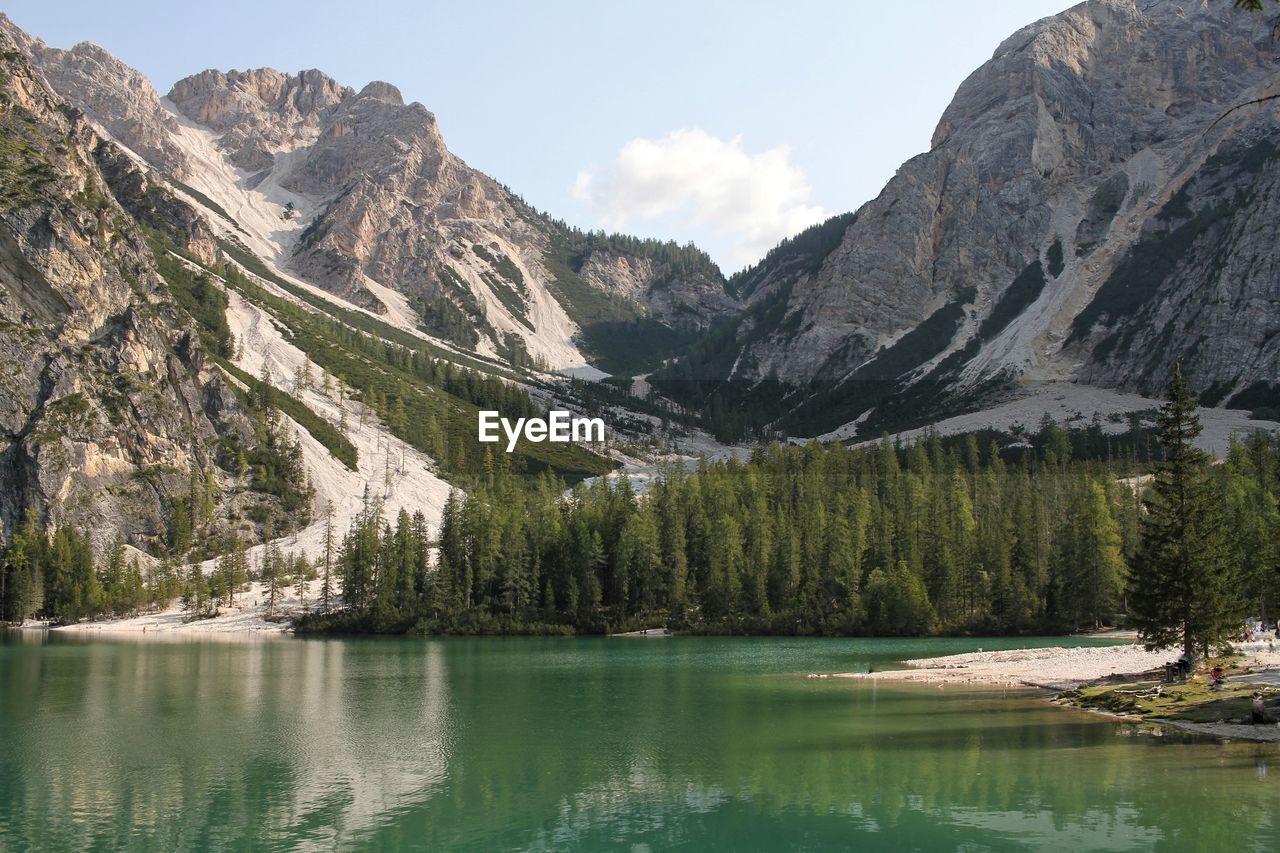 Scenic view of lake and mountains against sky