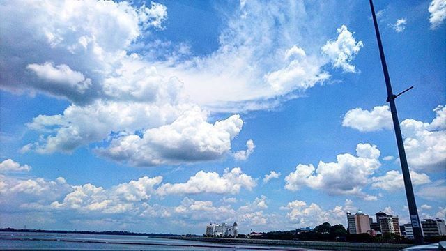 VIEW OF CITY AGAINST CLOUDY SKY